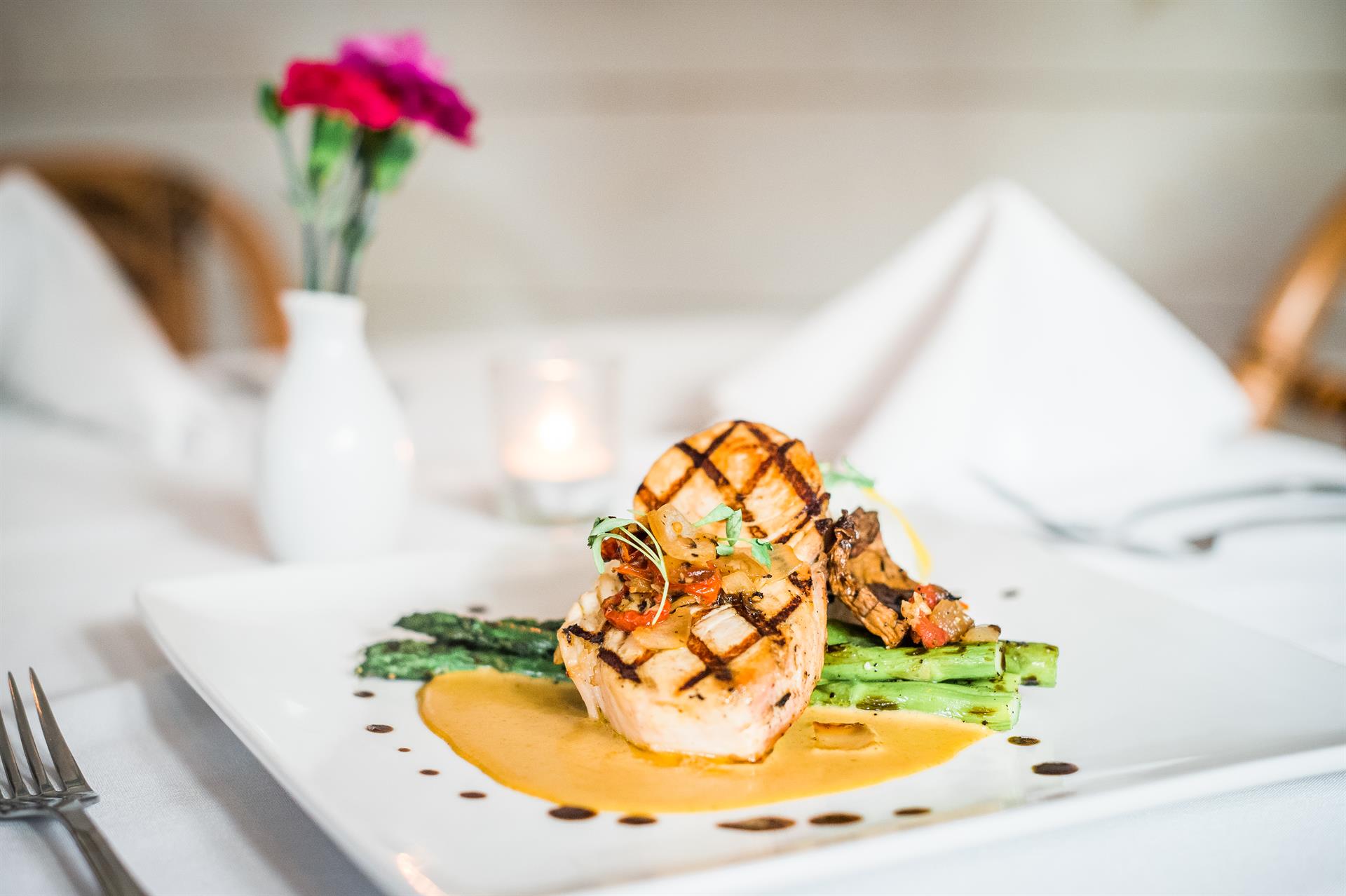 Plate of grilled fish and asparagus